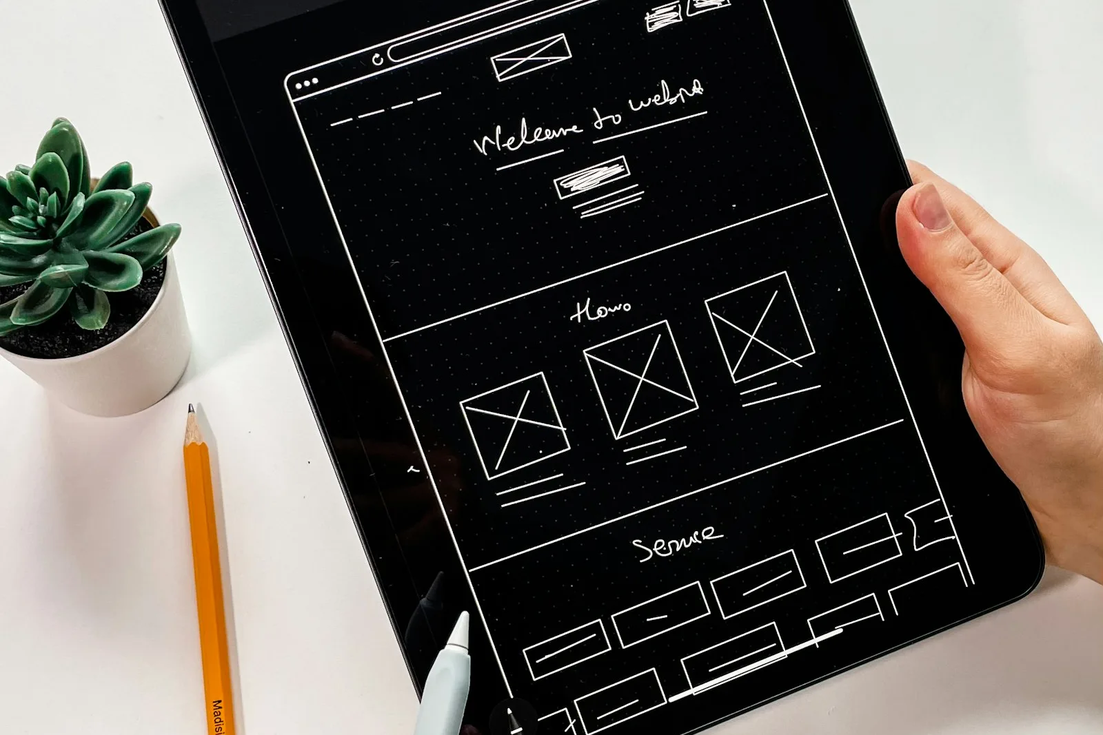 Wireframe sketch of a website on a tablet
